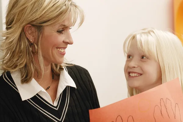 Daughter Showing Drawing To Her Mother — Stock Photo, Image