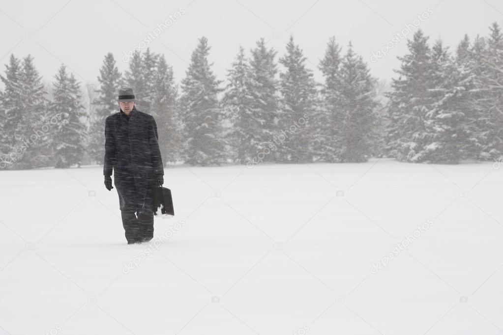Businessman Walking In The Snow