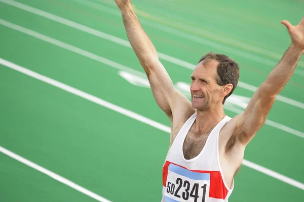 Um atleta comemorando — Fotografia de Stock