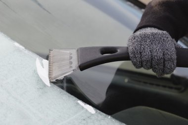 Scraping Frost On Car Window clipart