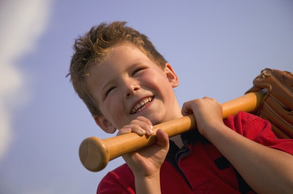 Smiling Boy With A Baseball Bat