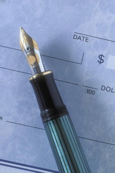 Fountain Pen And Cheque Royalty Free Stock Images