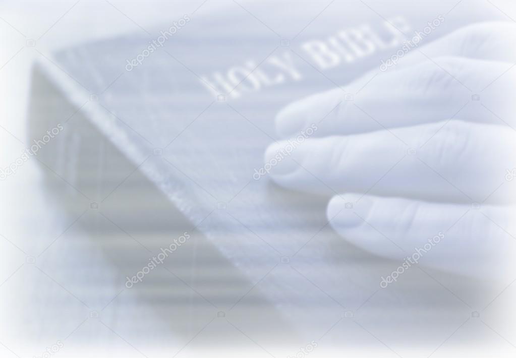 depositphotos_31680075 stock photo hand on bible background