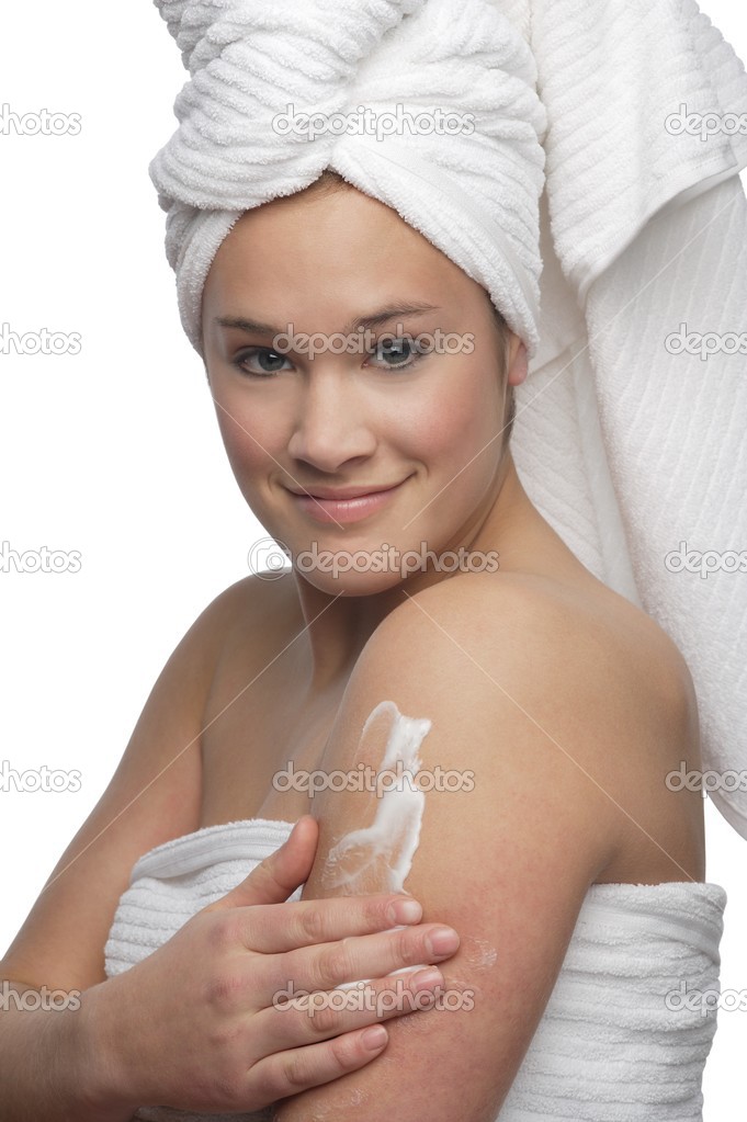 Woman Applying Lotion On Skin