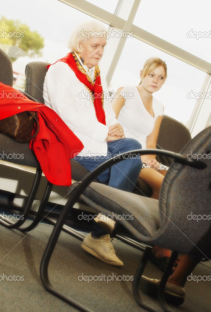 A Senior Woman And A Teenage Girl Waiting Together