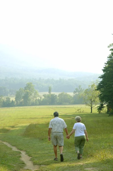 Seniors Go For A Walk — Stock Photo, Image