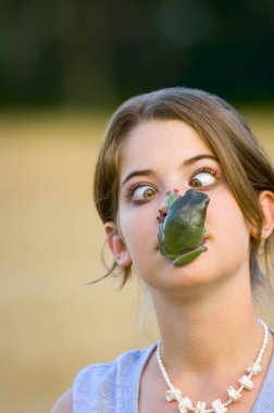Girl With Frog On Her Face clipart