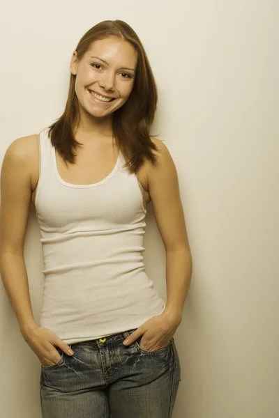 Young Woman Leaning Against Wall — Stock Photo, Image