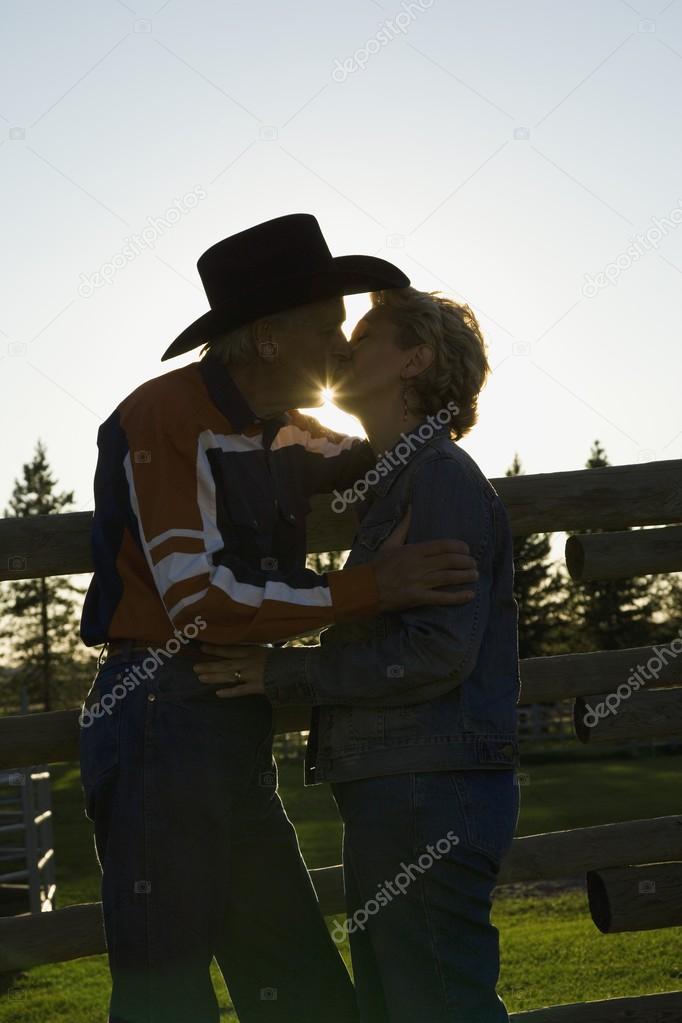 Couple Kissing At Ranch