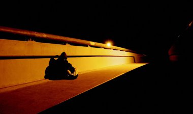 Homeless Person On Bridge At Night clipart