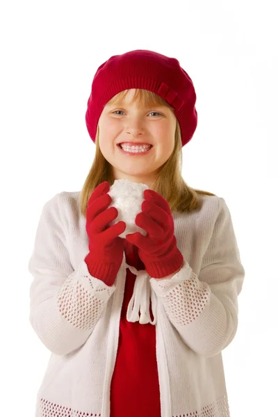 Menina em vermelho tinha e luvas segurando bola de neve — Fotografia de Stock