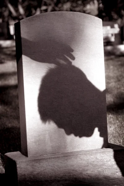 Shadow Of Hand Over Head Of Grieving Man At Grave Site — Stock Photo, Image