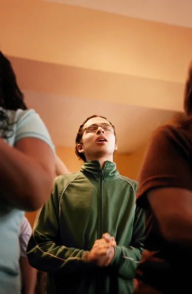 Young Man In Prayer Service