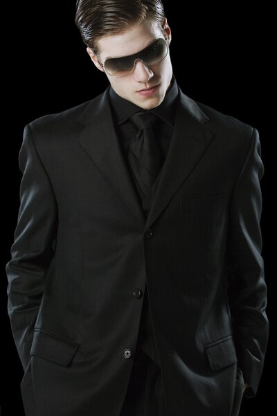 Man Wearing A Suit And Sunglasses