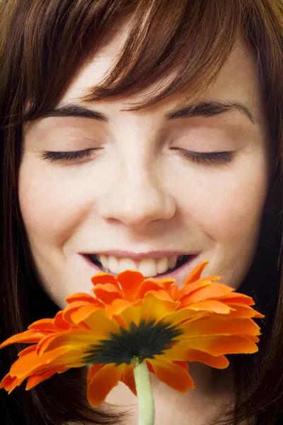 Women Enjoying Smell Of Flower Royalty Free Stock Images
