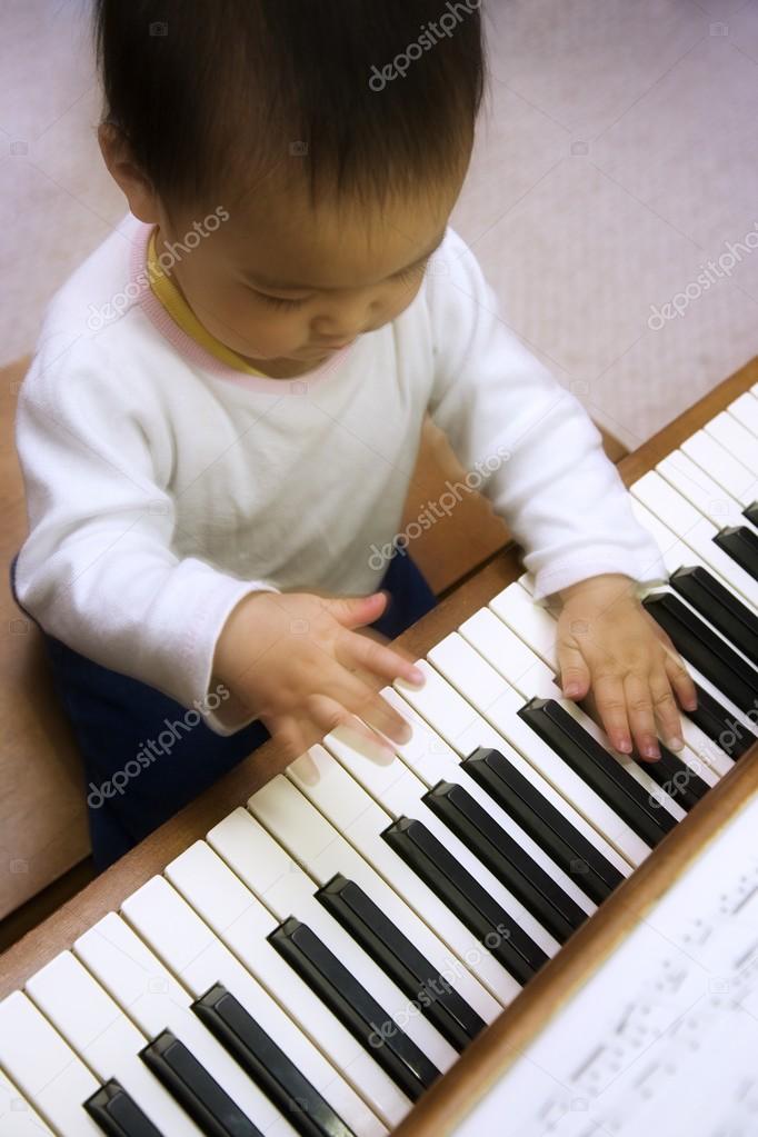 A Child Playing The Piano