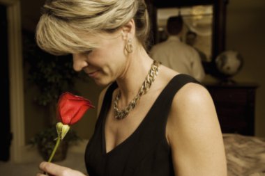 Woman Smelling A Red Rose clipart