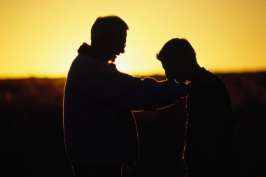 Silhouette Of A Father And Son clipart