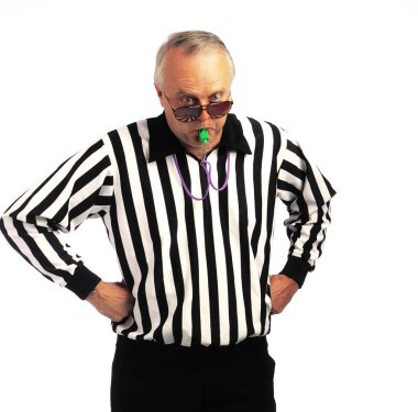 Referee With Hands On Hips Blowing A Whistle clipart