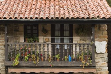 Wooden Balcony On Stone House In Village Of Barcena Mayor, Cantabria, Northern Spain clipart