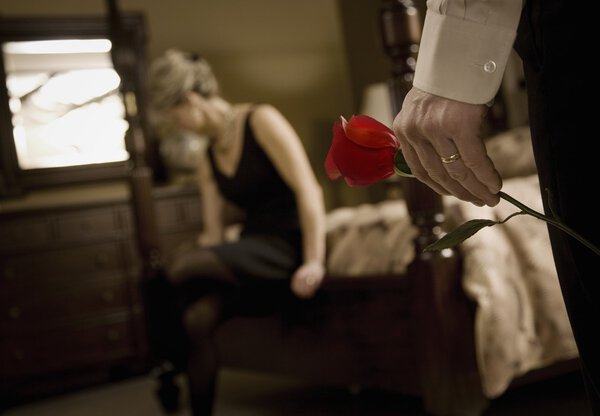 Man 's Hand holding Rose For Woman
