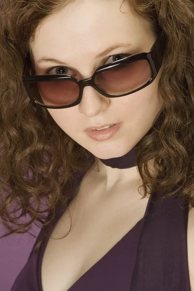 Brunette Woman Peering Over Sunglasses — Stock Photo, Image