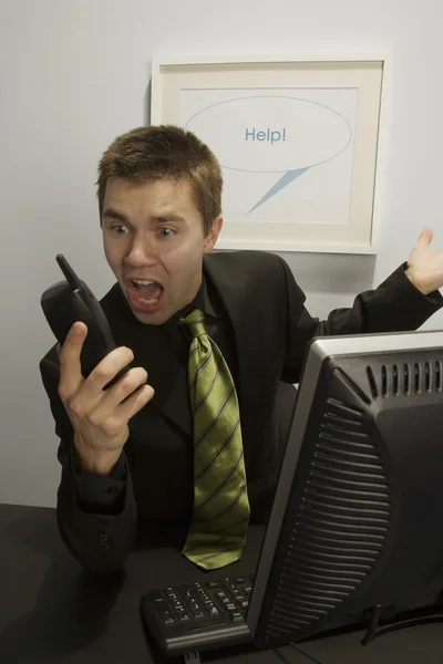 Businessman Screaming Into A Phone — Stock Photo, Image