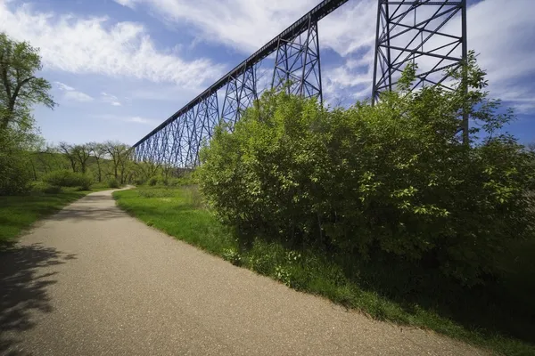 Road Alongside A Railway Bridge In Lethbridge, Alberta — Stock Photo, Image