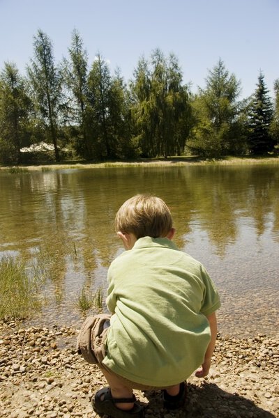 Boy Beside Stream