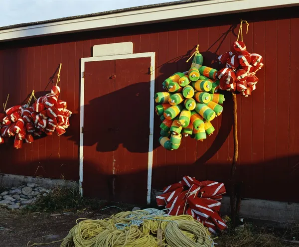 Fishing Buoys Hanging On An Outside Wall — Stock Photo, Image