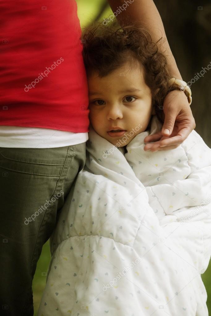 Child Wrapped Up In Blanket At Mother's Side
