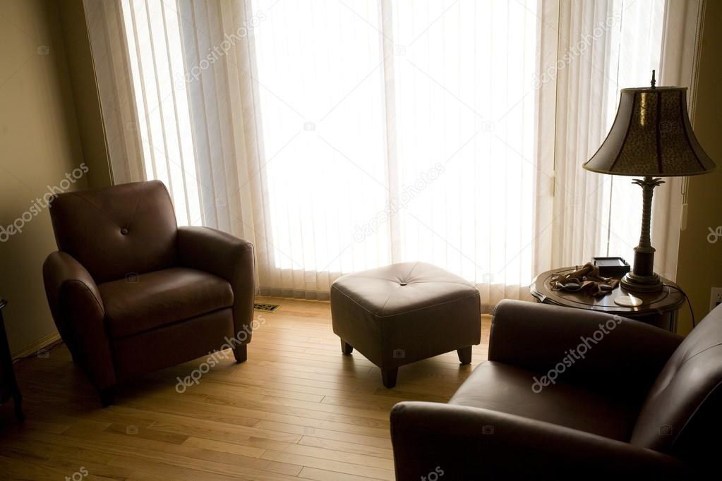 Living Room With Armchairs And Ottoman