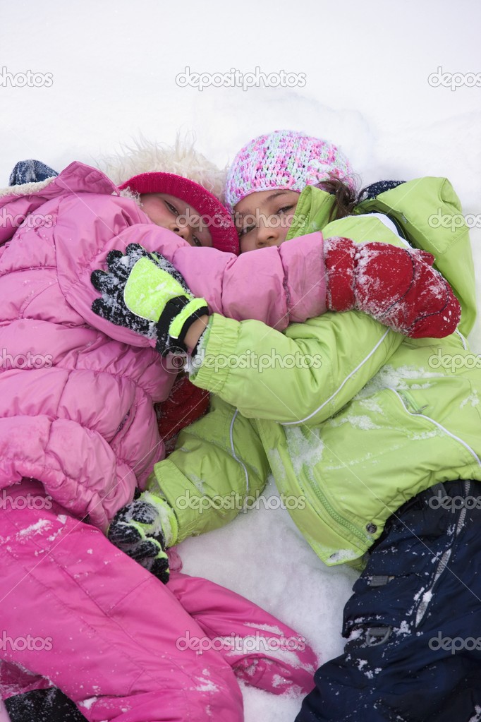 Friends Lying In The Snow