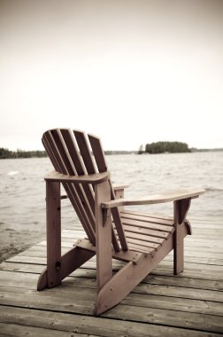 Adirondack Chair On Deck, Muskoka, Ontario, Canada clipart