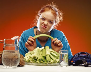 Women With Plate Of Celery And Sports Equipment clipart