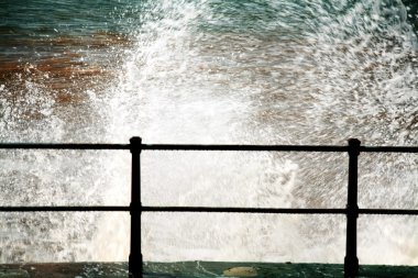 Sidmouth, Devon, England, United Kingdom. Waves Crashing Against The Seawall clipart