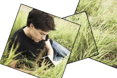 Teenage Boy Reading In The Grass clipart