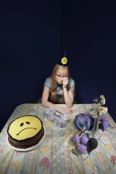 Upset Girl Surrounded By Party Supplies — Stock Photo, Image
