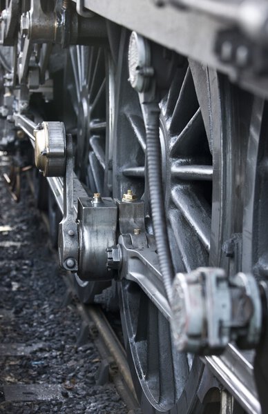 Close-up of steam engine train wheel
