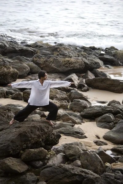 A Man Stretching On A Rocky Beach In Koh Lanta, Thailand — Stock Photo, Image