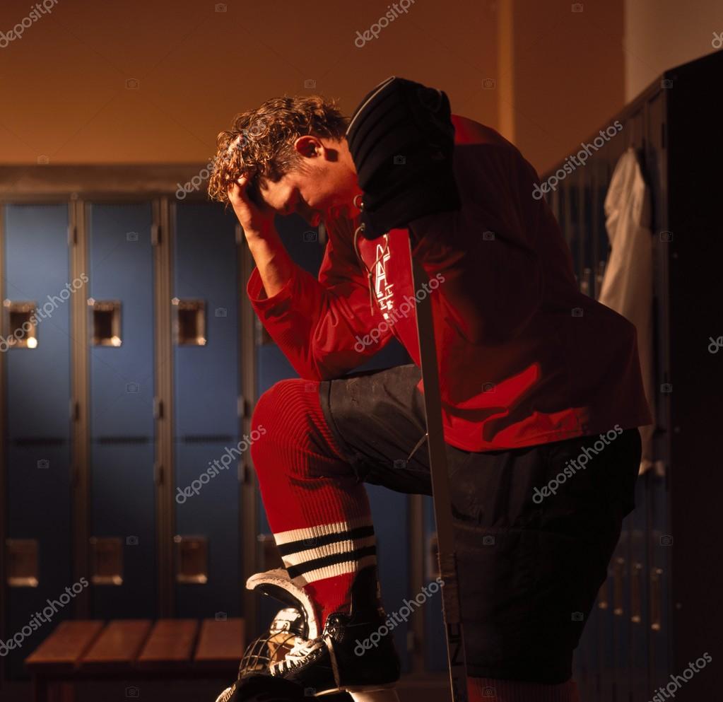 Hockey Player In Dressing Room — Stock Photo © DesignPicsInc 31791613