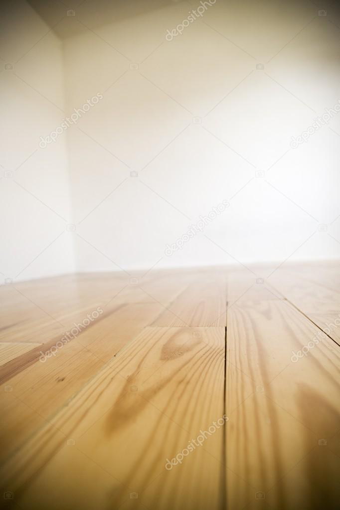 Empty Room With Wooden Floors And White Walls