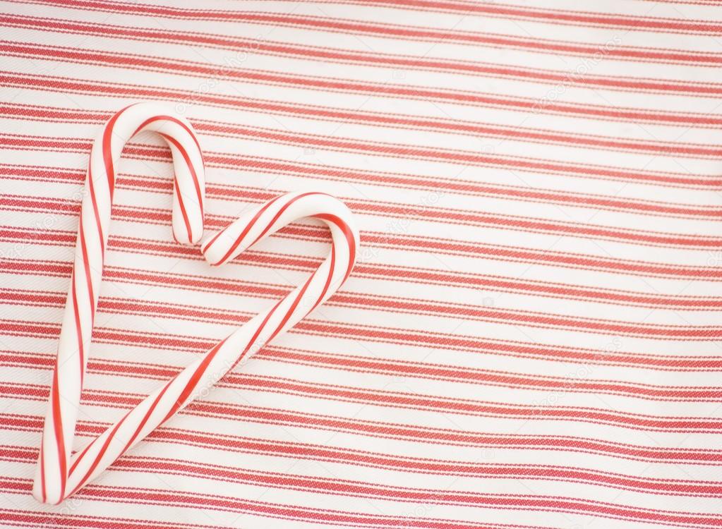 Two Candy Canes Making A Heart Shape