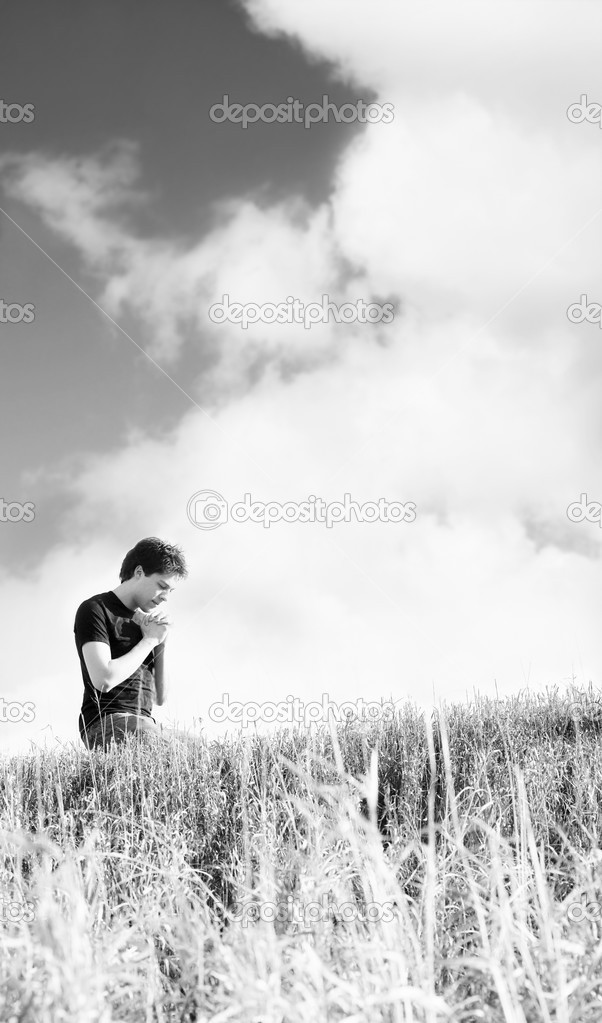 Man Praying Outdoors