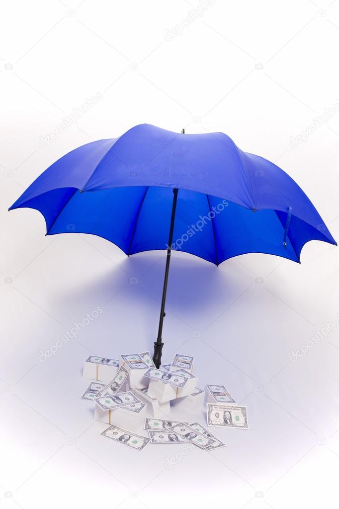 Umbrella covering piles of money