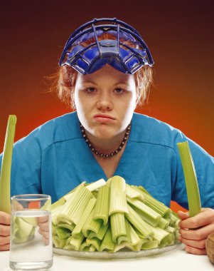 Woman In Sports Gear Eating Celery clipart