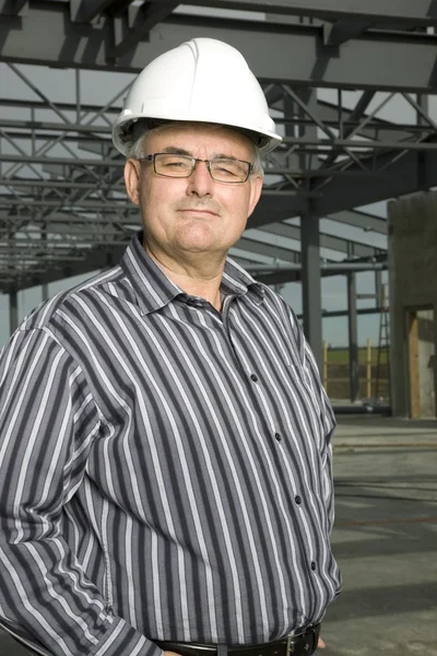 Man In Hardhat In Partially Built Building — Stock Photo, Image