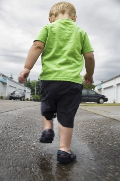 Boy Walking In A Puddle — Stock Photo, Image