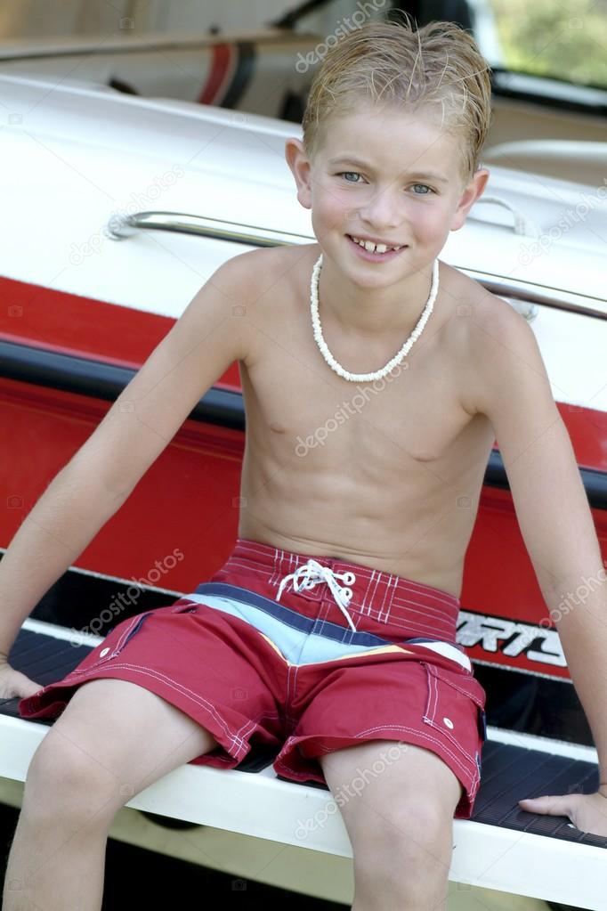 Boy sitting on boat