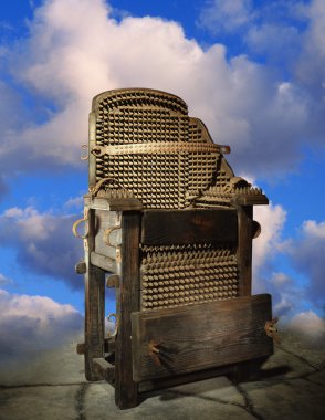 Electric Chair Against A Background Of Clouds clipart
